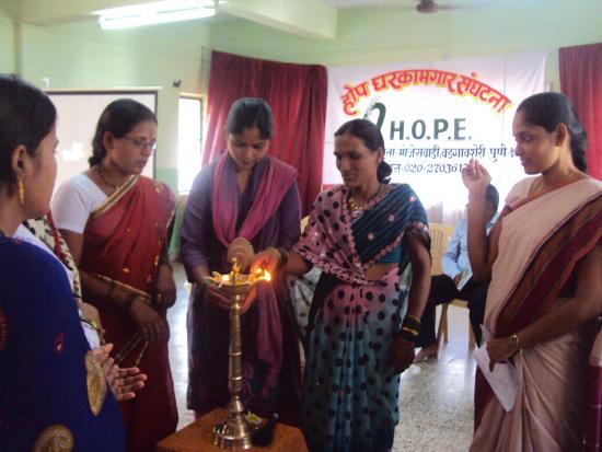 Domestic workers lighting the traditional lamp to begin the celebration on the 4th May 2013